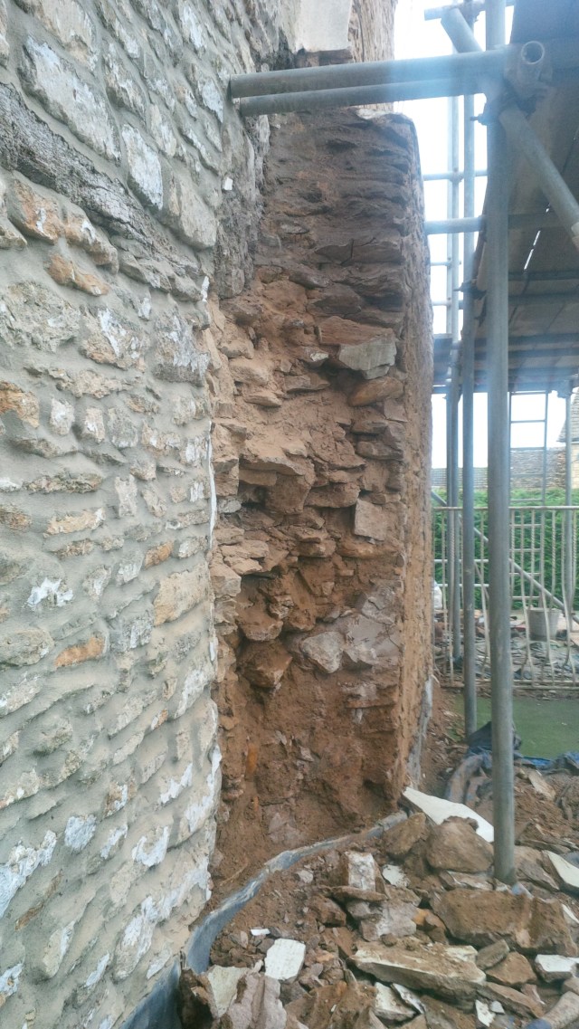 view of the left hand flank showing the ragged quality of the masonry