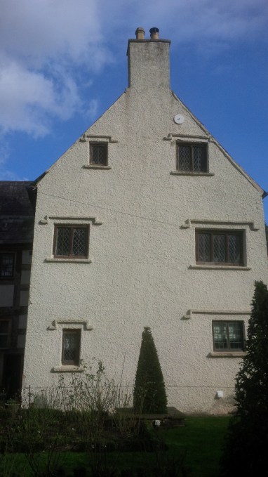 a white painted cement rendered gable